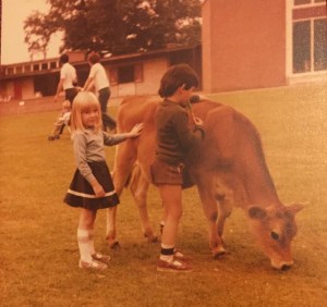 Rebecca petting a cow